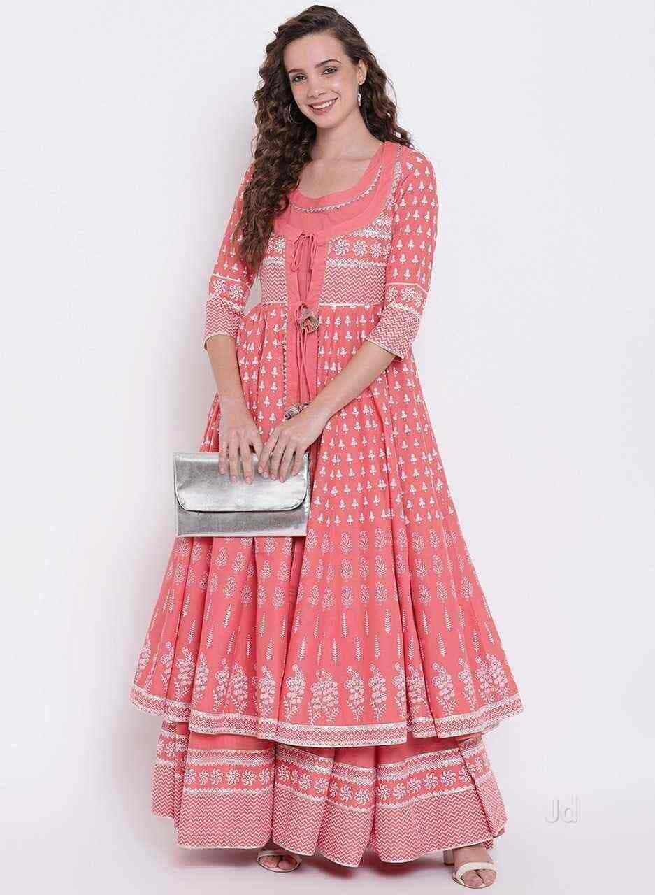 Model in a coral-pink tiered anarkali