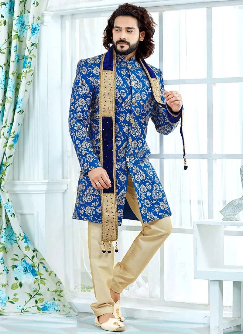 Model in a royal blue achkan sherwani with stole